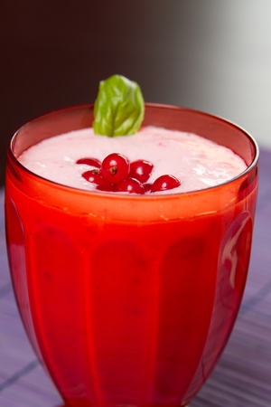 a red currant milkshake in red glassの写真素材
