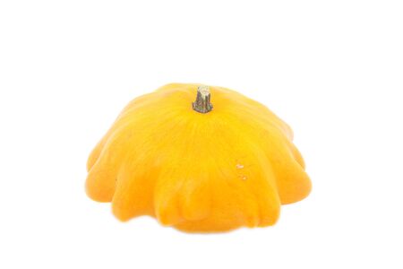 one decorative orange pumpkin against white backgroundの写真素材