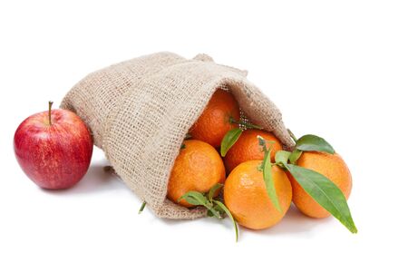 Mandarins in the sack isolated on whiteの写真素材