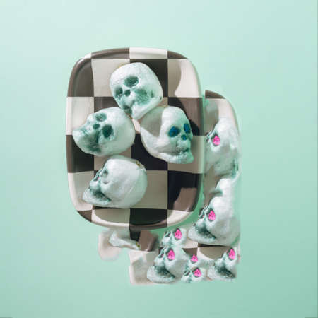 Crypto nft aesthetic skull. The background is a combination of black and white and pastel colors.の写真素材