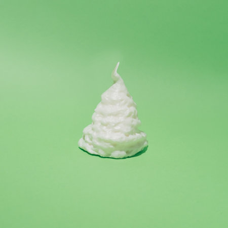 Sweet cold ice cream on tap without cone.Pastel green color background.Minimalism conceptual set.の写真素材