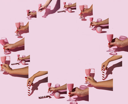 Pattern in a circular shape composed of female hands holding an ornament or a glass of champagne. Pastel pink background. Festive mood and cheerfulness.の写真素材