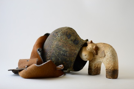 bell copper at belt cowhide and ceramic cowの写真素材