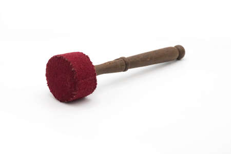 A large stick for a Tibetan Singing Bowl. Isolated on a White background