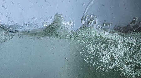 the water is turbulent. sprays, drops and bubblesの写真素材