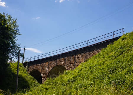 the old railway bridge is built of stone. historic building usedの写真素材