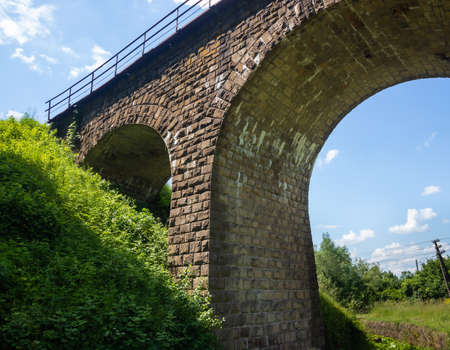 the old railway bridge is built of stone. historic building usedの写真素材