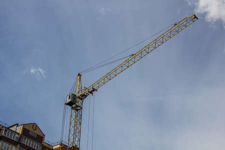 construction crane on sky background at construction site