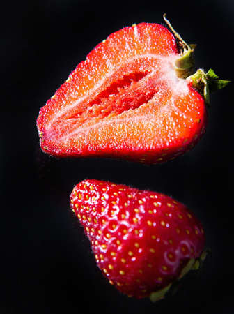 Ripe strawberries on a solid background, healthy vegetarian food. Beautiful