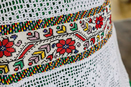 traditional clothes and beaded jewelry. traditional ornaments and patterns. handmade.