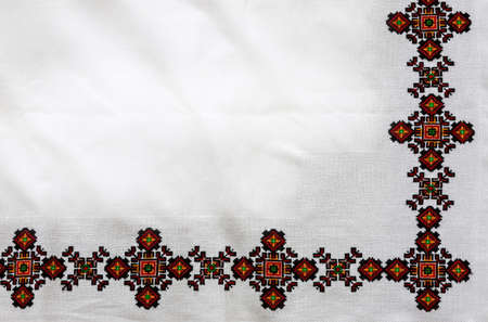 cross-stitch products folk crafts ornaments and patterns embroidered on canvas. linen cloth