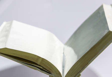 blank white open book on a uniform background