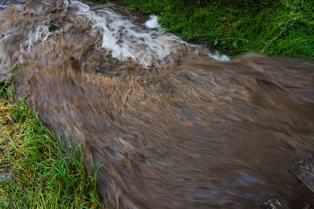 powerful waterfall with dirty water after the hard rainの写真素材