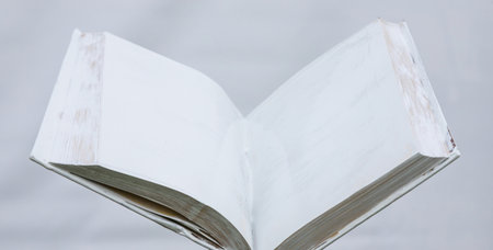 blank white open book on a uniform backgroundの写真素材