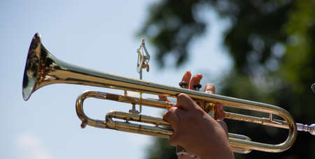 playing a brass instrument. military band performs at the festivalの写真素材