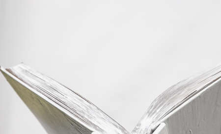 blank white open book on a uniform backgroundの写真素材