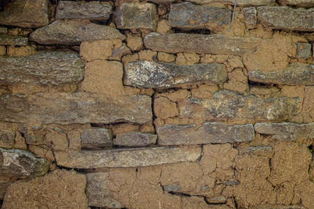 Background of stone wall texture brown photo material.の写真素材
