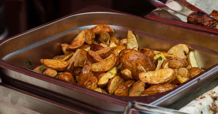 delicious grilled fried potatoes. street food. potat.の写真素材