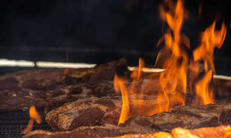 The pork ribs grilling with bbq glaze street food.の写真素材