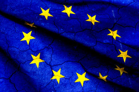 policy, crisis and national security concept - flag of europe on cracked ground background.の写真素材