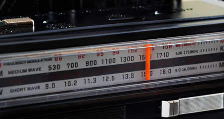 Tuning Analog Radio Dial Frequency on Scale of the Vintage Receiver.の写真素材