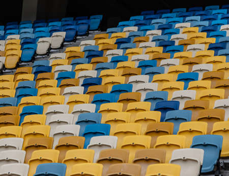 empty colorful seats on tribunes of stadium.