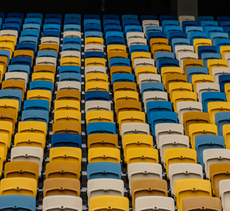 empty colorful seats on tribunes of stadium.の写真素材