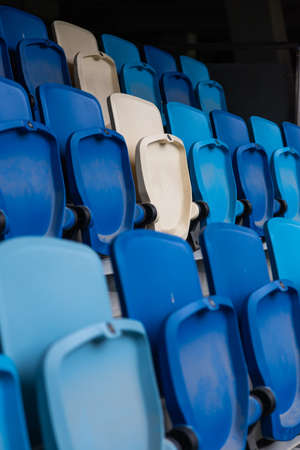 empty colorful seats on tribunes of stadium.の写真素材
