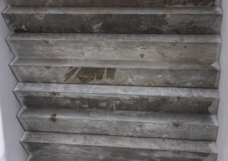 Gray concrete staircase in modern contemporary minimalistic interior.