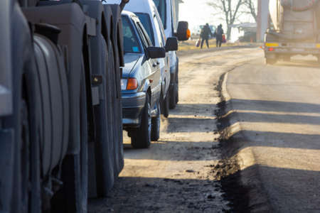 Traffic jam on busy road cars in row.