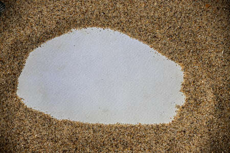 Summer style with empty blank paper card on a sea sand. summer card background for add text.の写真素材