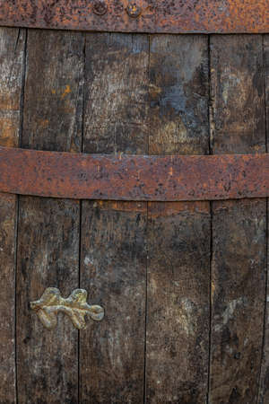 wooden barrel with metal rusty straps template background.の写真素材