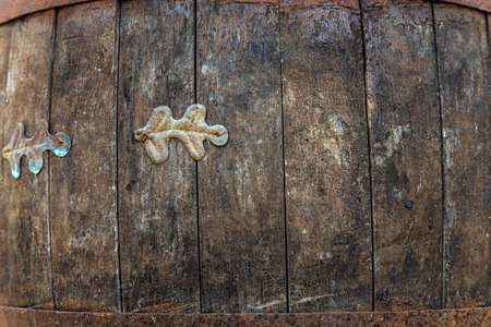 wooden barrel with metal rusty straps template background.の写真素材