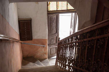 old entrance stairs in the stairwell of an apartment house.の写真素材