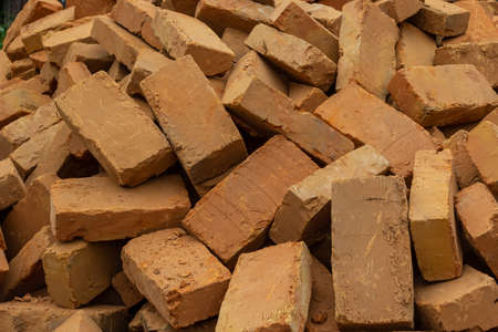Solid clay brick used for construction. Background, brown red color.の写真素材