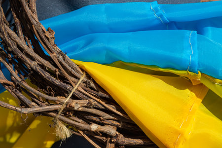 Yellow-blue, colors of the Ukrainian national flag, fabric ribbon intertwined on the frame. Symbol of the celebration of Ukraine's independence.の写真素材