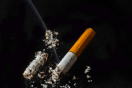 Cigarette smoking closeup isolated on balck background. no smoking concept.