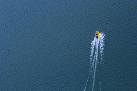 A top-down view of the speed of a motorboat sailing on water.