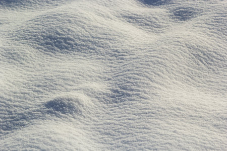 background of fresh snow texture in blue tone.