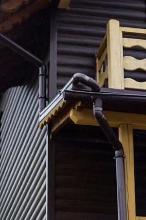 Holder gutter drainage system on the roof. Drain on the roof of the house. Roof drainage. Water drainage from the roof.の写真素材