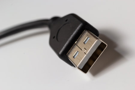 Close up of USB cable on white background. Data transfer technologies between devices via cable.の写真素材