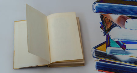 Open old book with blank pages and free space for text. The concept of reading literature, education...