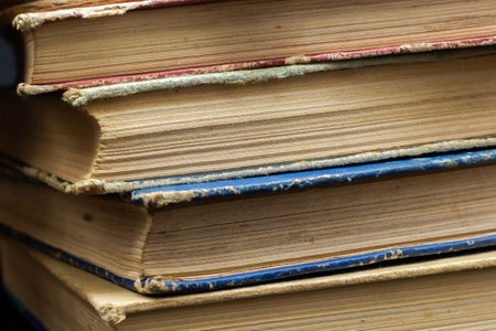 book background. Stack of books in the library. Old yellow pages of paper books. learning and knowledge.の写真素材