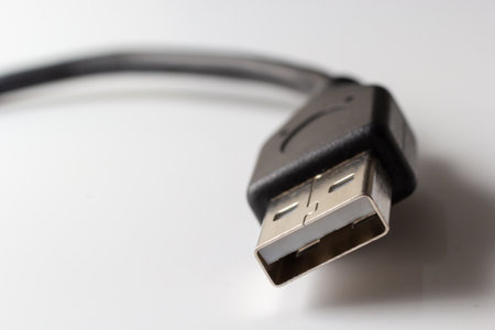 Close up of USB cable on white background. Data transfer technologies between devices via cable.の写真素材