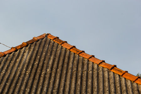 Old Asbestos Cement Slate Roofs. Asbestos Release from Asbestos-cement Slate Roofing Buildings.の写真素材