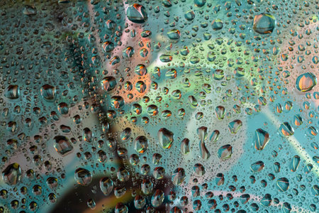 abstract background fall, glass drops autumn yellow leaves wet October weather.