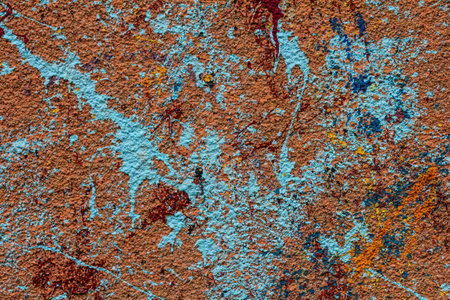 White plastered wall splattered with red paint. Paint splashes on the wall. Painted poster wall....