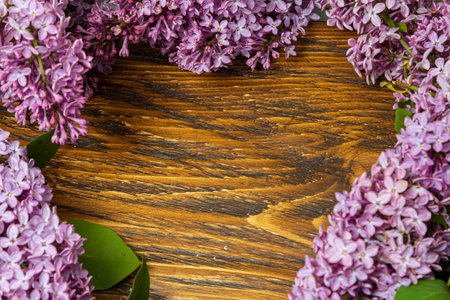 Beautiful spring flowers lilac on a wooden vintage board with place for text. Syringa vulgaris....