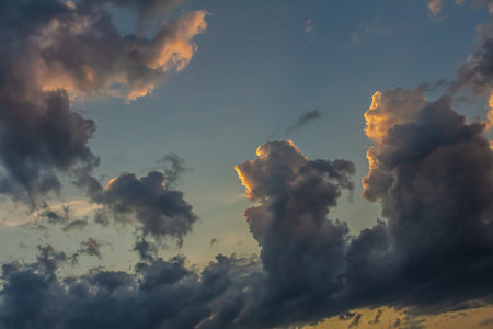 Dramatic clouds fill the sky at sunset reflecting soft colors that blend beautifully. This serene...