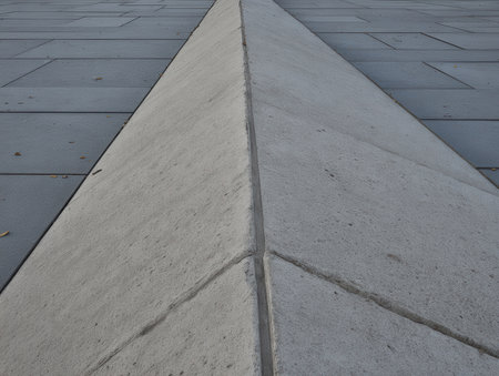 A geometric abstract features floor screed guides arranged at sharp angles highlighting the smooth textures and clean lines under natural light.の素材